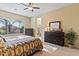 Spacious bedroom with plush carpeting and a ceiling fan at 1613 W Ainsworth Dr, Anthem, AZ 85086