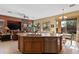 Kitchen island with double sink, dishwasher, and breakfast bar seating at 1613 W Ainsworth Dr, Anthem, AZ 85086