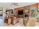 Living room with fireplace, leather furniture, and tile floors at 1613 W Ainsworth Dr, Phoenix, AZ 85086