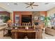 Open concept living room with fireplace and entertainment center at 1613 W Ainsworth Dr, Anthem, AZ 85086