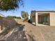 Paved patio and landscaped backyard with a block wall at 19724 N Lief Rd, Maricopa, AZ 85138