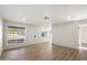 Living room with wood-look floors, recessed lighting, and view of the kitchen at 25 N Cottonwood St # 60, Chandler, AZ 85225