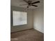 Bright bedroom with neutral walls and carpeting at 3630 N 86Th Ave, Phoenix, AZ 85037