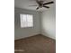 Bedroom with neutral walls and carpeting, window with blinds at 3630 N 86Th Ave, Phoenix, AZ 85037