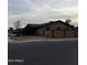 Tan one-story house with a red-trimmed block wall and small front yard at 3630 N 86Th Ave, Phoenix, AZ 85037
