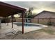 Backyard with kidney-shaped pool and covered patio area at 3630 N 86Th Ave, Phoenix, AZ 85037