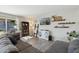 Living room with sectional sofa, TV, and built-in shelves at 6124 N Florence Ave, Litchfield Park, AZ 85340