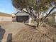 Front exterior view of a two-story home with attached garage and driveway at 6318 W Christy Dr, Glendale, AZ 85304