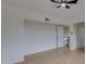 Bright bedroom with wood-look flooring, white walls, and a ceiling fan at 6748 W Shangri La Rd, Peoria, AZ 85345