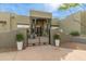 Elegant home entrance with an iron gate and landscaping at 8325 W La Caille --, Peoria, AZ 85383