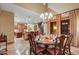 Elegant dining room with a chandelier and access to a patio at 8330 E Sunset View Dr, Gold Canyon, AZ 85118