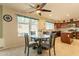 Kitchen with dining area, ceiling fan, and natural light. Updated finishes at 8614 W Purdue Ave, Peoria, AZ 85345