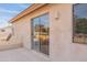 Private balcony with sliding glass door access and neighborhood views at 9902 E Meseto Ave, Mesa, AZ 85209