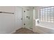 Clean bathroom featuring a glass shower, soaking tub, and frosted window at 9902 E Meseto Ave, Mesa, AZ 85209