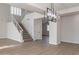 Dining area adjacent to the staircase with modern light fixture at 9902 E Meseto Ave, Mesa, AZ 85209