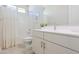 Modern bathroom with white vanity, shower/tub combo, and large mirror at 1365 E Avenida Ellena Ln, Casa Grande, AZ 85122