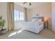 Bright bedroom with large window, neutral carpet, and a cozy bed at 1365 E Avenida Ellena Ln, Casa Grande, AZ 85122