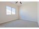 Cozy bedroom with neutral walls, carpet, and a large window at 1365 E Avenida Ellena Ln, Casa Grande, AZ 85122