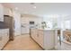 Bright kitchen with island, stainless steel appliances, and ample storage at 1365 E Avenida Ellena Ln, Casa Grande, AZ 85122
