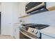 Modern kitchen featuring stainless steel appliances, white cabinets, and subway tile backsplash at 1365 E Avenida Ellena Ln, Casa Grande, AZ 85122