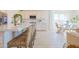 Modern kitchen with white cabinets, large island, and stainless steel appliances at 1365 E Avenida Ellena Ln, Casa Grande, AZ 85122