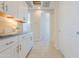 Laundry room with cabinets, counter space, and access to additional rooms at 1365 E Avenida Ellena Ln, Casa Grande, AZ 85122