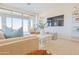 Inviting living room with sliding glass doors, neutral decor, and a cozy seating area at 1365 E Avenida Ellena Ln, Casa Grande, AZ 85122
