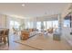 Open concept living room with sliding glass doors and modern decor at 1365 E Avenida Ellena Ln, Casa Grande, AZ 85122