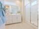 Main bathroom with glass shower, white vanity, and tiled flooring at 1365 E Avenida Ellena Ln, Casa Grande, AZ 85122