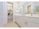 Spacious bathroom featuring a double vanity, large mirror, and walk-in closet at 1365 E Avenida Ellena Ln, Casa Grande, AZ 85122