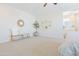 Main bedroom corner with a bench, potted plant, and wall decor at 1365 E Avenida Ellena Ln, Casa Grande, AZ 85122