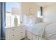 A corner of the main bedroom with nightstands, a bed, and large windows at 1365 E Avenida Ellena Ln, Casa Grande, AZ 85122