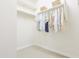 Spacious walk-in closet with built-in shelving and hanging rods at 1365 E Avenida Ellena Ln, Casa Grande, AZ 85122