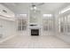 Living room featuring a fireplace, built-in shelving, and tile floors at 14039 N 13Th St, Phoenix, AZ 85022