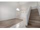 Living area with staircase, tile and wood-look flooring, and high ceilings at 14039 N 13Th St, Phoenix, AZ 85022