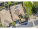 Aerial perspective highlighting a house's roofline and its surrounding neighborhood at 1741 E Adelante Way, Queen Creek, AZ 85140