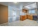 Kitchen with breakfast bar, wood cabinets, and tile floors at 1906 N Evergreen St, Chandler, AZ 85225