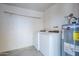 Laundry room with washer, dryer, and water heater at 1906 N Evergreen St, Chandler, AZ 85225