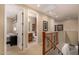 Upstairs hallway leading to bedroom and bathroom at 19409 W Pasadena Ave, Litchfield Park, AZ 85340