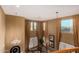 Living room with high ceilings, large windows, and a chandelier, seen from above at 19409 W Pasadena Ave, Litchfield Park, AZ 85340