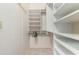 Spacious walk-in closet with built-in shelves and hanging rods at 2233 E Behrend Dr # 146, Phoenix, AZ 85024