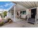 Inviting covered patio with outdoor dining area and access to the home's entrance at 2233 E Behrend Dr # 146, Phoenix, AZ 85024