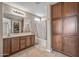 Main bathroom with a double vanity and linen closet at 23847 W Lumbee St, Buckeye, AZ 85326