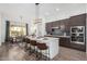 Modern kitchen with stainless steel appliances and island at 3188 N 167Th Dr, Goodyear, AZ 85395