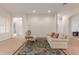 Living room with tile flooring, white walls, and a couch at 33010 N 23Rd Ave, Phoenix, AZ 85085