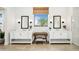 Elegant bathroom featuring dual vanities and a vanity stool at 42140 N Golden Trl, San Tan Valley, AZ 85140