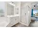 Main bathroom boasting dual vanities, a glass shower, and view to the bedroom at 4655 N 183Rd Dr, Goodyear, AZ 85395