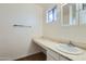 Simple bathroom with single vanity, white sink, and tiled flooring at 4716 S Taylor Dr, Tempe, AZ 85282