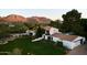 Aerial view of a beautiful Spanish-style home on a large lot with mountain backdrop at 5057 E Sky Desert Ln, Paradise Valley, AZ 85253