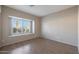 Bright bedroom with wood flooring and large window with shutters at 6123 W Grandview Rd, Glendale, AZ 85306